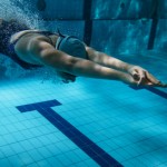 Swimmers at the swimming pool.Underwater photo